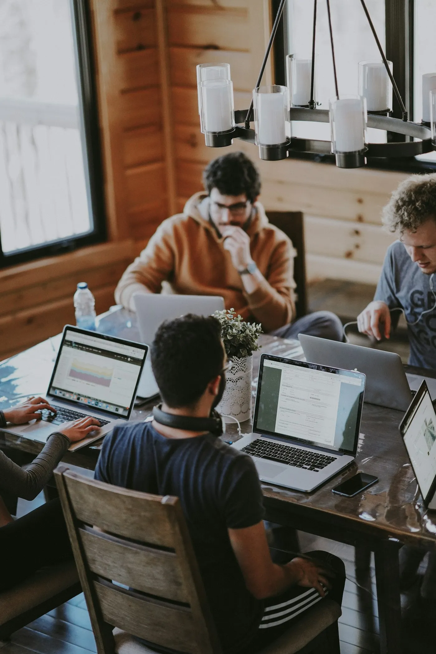 A diverse team collaborating in a modern office, breaking down silos